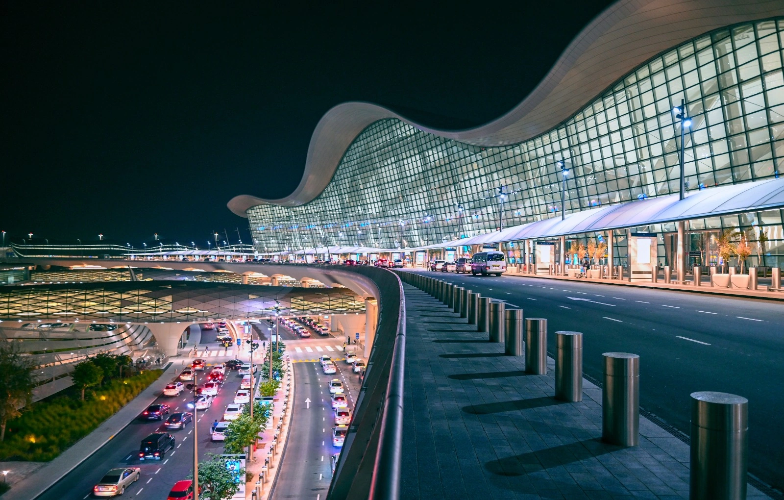 Abu Dhabi Layover Tours driver meeting guests at Zayed International Airport arrivals